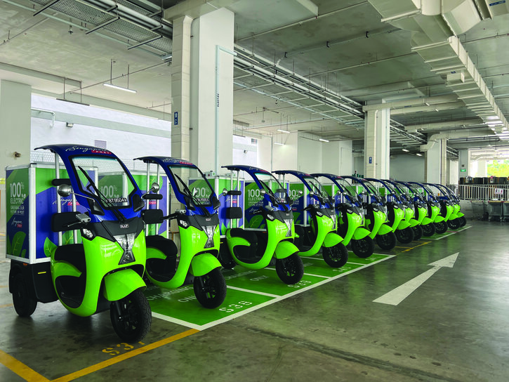 Row of green electric delivery bikes