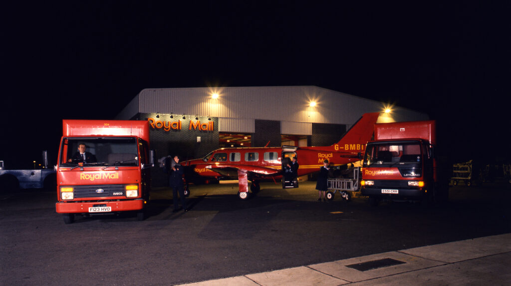 Airmail 1989 - East Midlands Airport, Derby. Mail is being loaded from mail vans to a waiting Royal Mail aeroplane.