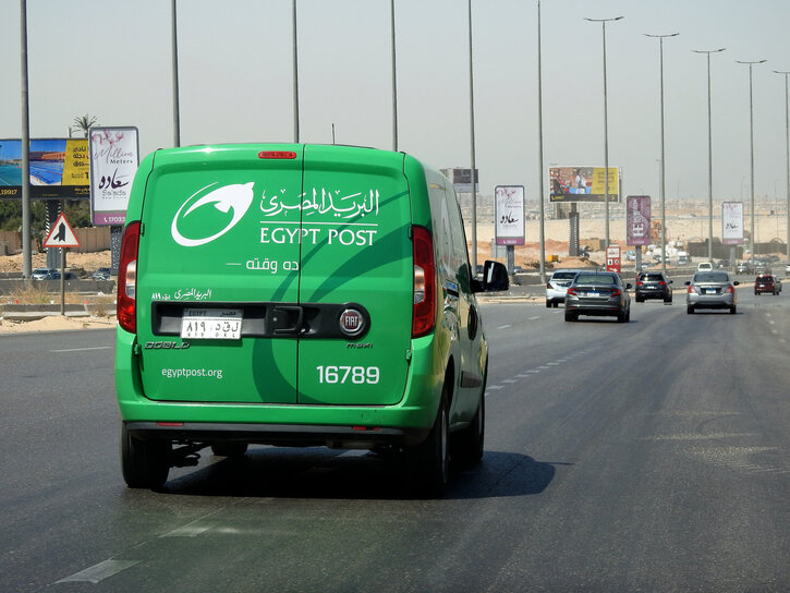 Cairo, Egypt, May 10 2023: Egyptian post delivery truck van mobile car service on the highway road, Egypt post is Egyptian agency responsible for postal service in Egypt established in 1865